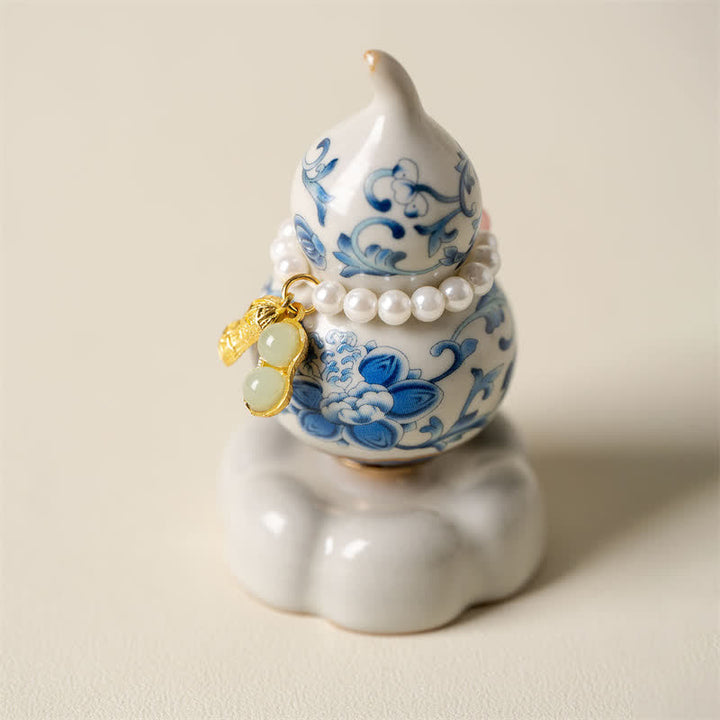 Buddha Stones Decoración de vida consciente con forma de calabaza y loto giratoria de cerámica azul y blanca - Base blanca aprox. 4,8 cm × 4,8 cm × 8,5 cm - image 0