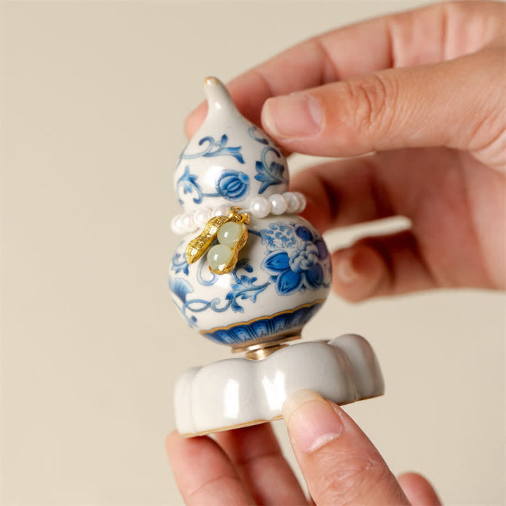 Buddha Stones Decoración de vida consciente con forma de calabaza y loto giratoria de cerámica azul y blanca - image 3