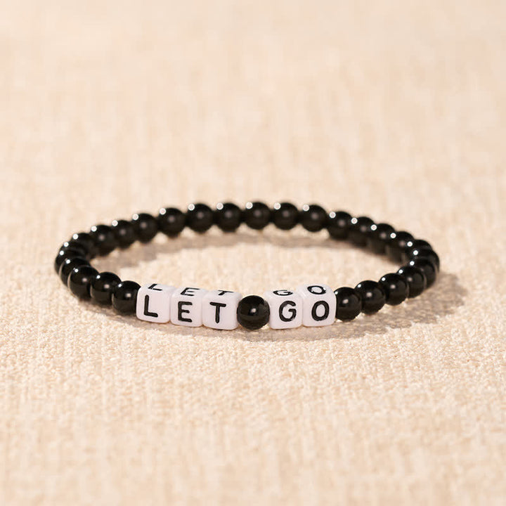Buddha Stones Pulsera de cuentas de fuerza con letras de obsidiana negra "LET GO" - image 1
