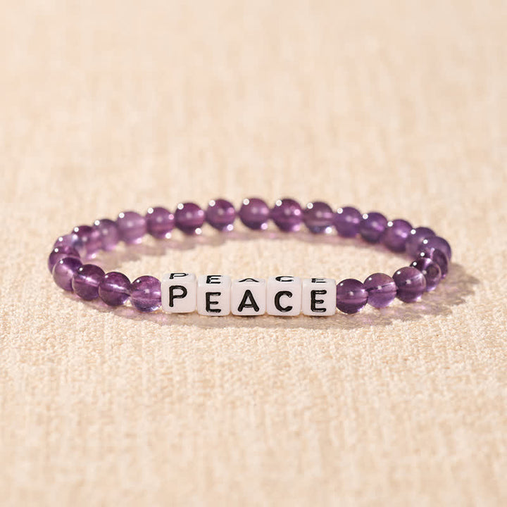 Buddha Stones Pulsera de meditación con cuentas de amatista con la inscripción PAZ - image 1