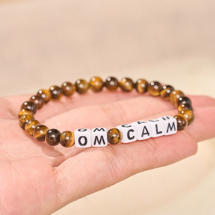 Buddha Stones Pulsera de cuentas con letras OM CALM y ojo de tigre - image 2