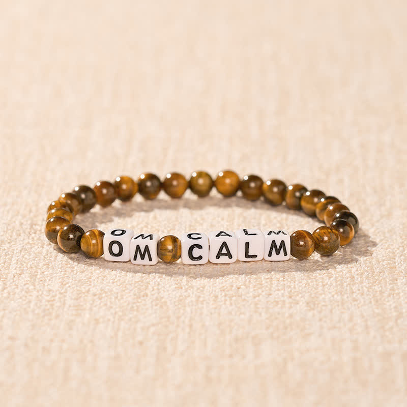 Buddha Stones Pulsera de cuentas con letras OM CALM y ojo de tigre - image 1
