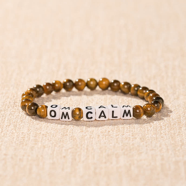Buddha Stones Pulsera de cuentas con letras OM CALM y ojo de tigre - image 1