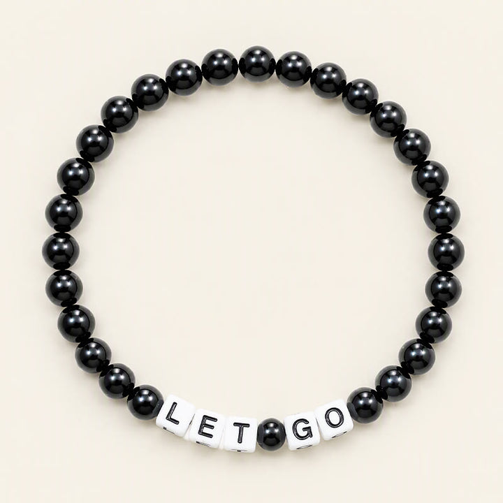 Buddha Stones Pulsera de cuentas de fuerza con letras de obsidiana negra "LET GO" - Obsidiana negra (Purificación ♥ Transformación) - image 0