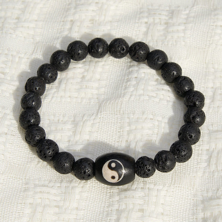 Buddha Stones Pulsera de soporte con cuentas Yin Yang de ónix negro y roca volcánica - image 1