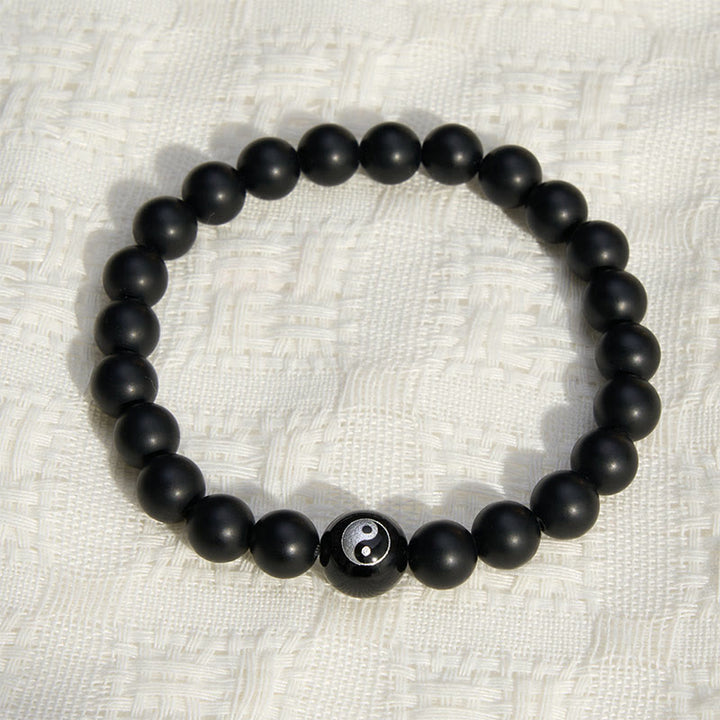 Buddha Stones Pulsera de equilibrio con cuentas redondas de ónix negro, turquesa blanca y yin yang de obsidiana negra. - image 1