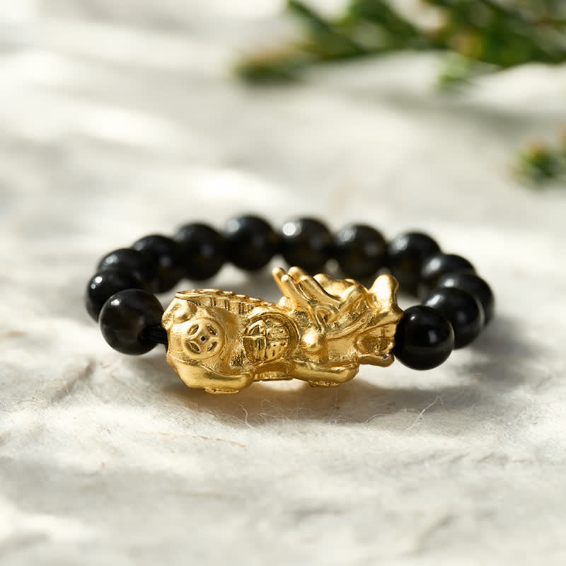 Buddha Stones Anillo elástico mini Pi Xiu de cobre y obsidiana negra para fuerza y ​​energía. - image 1