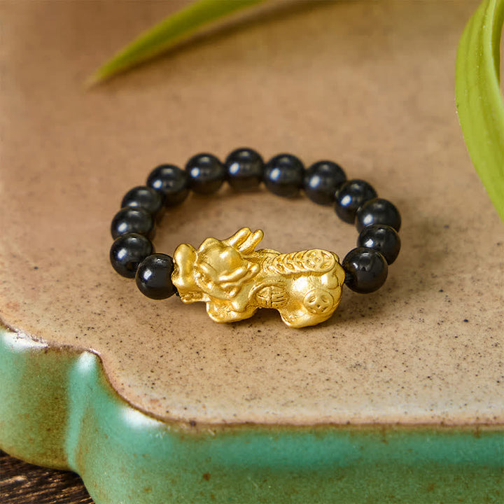 Buddha Stones Anillo elástico mini Pi Xiu de cobre y obsidiana negra para fuerza y ​​energía. - image 2