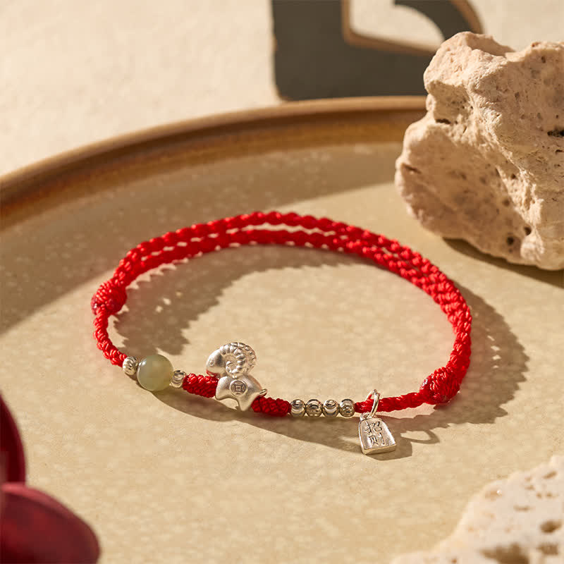 Buddha Stones Pulsera de plata de ley 999 con hilo rojo para la suerte del Año de la Cabra - image 1