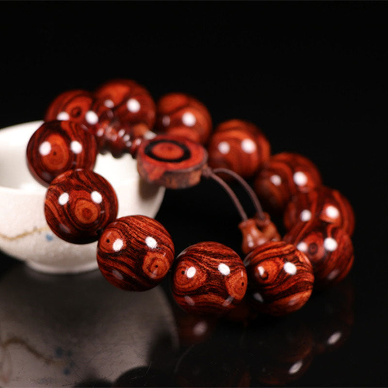 Pulsera cálida de palisandro tibetano con Buddha Stones (tipo aleatorio)
