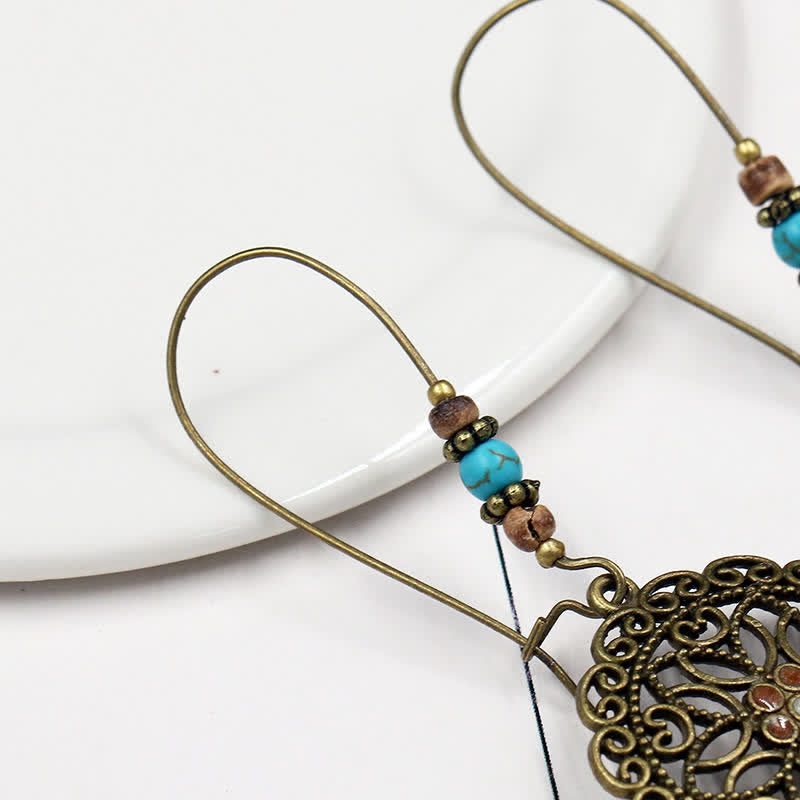 Pendientes colgantes redondos de la suerte con diseño de flores