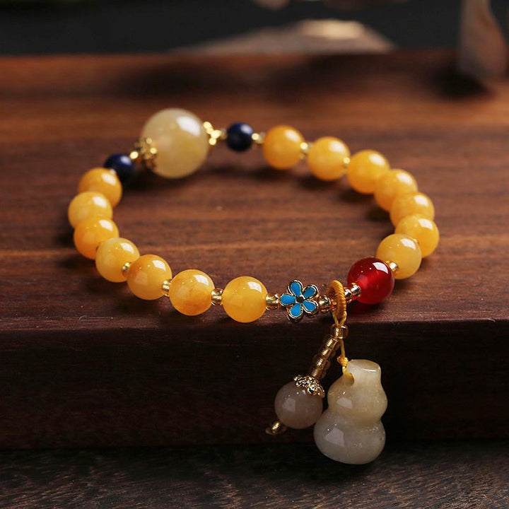 Pulsera de la suerte de la riqueza del encanto de la calabaza del jade de la seda dorada natural de las Buddha Stones