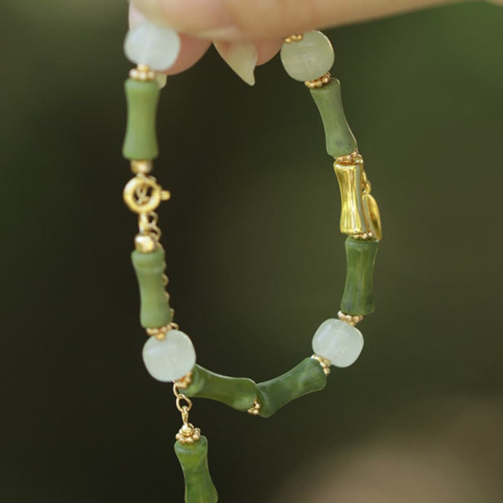 Pulsera de riqueza con Buddha Stones, bambú verde, jade, lirio de los valles