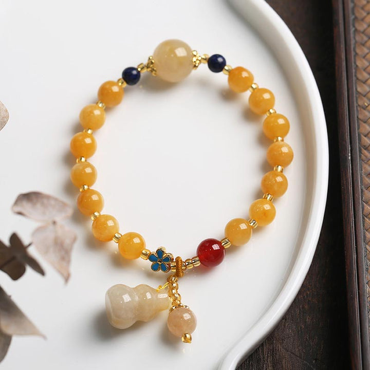 Pulsera de la suerte de la riqueza del encanto de la calabaza del jade de la seda dorada natural de las Buddha Stones