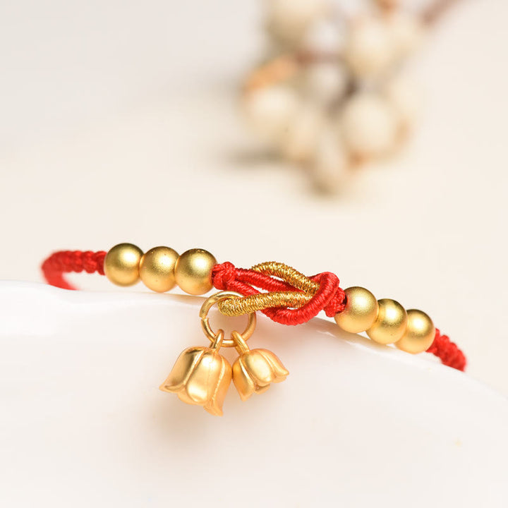 Pulsera trenzada de protección de la suerte con diseño de amuleto de flor de lirio de los valles hecha a mano con Buddha Stones