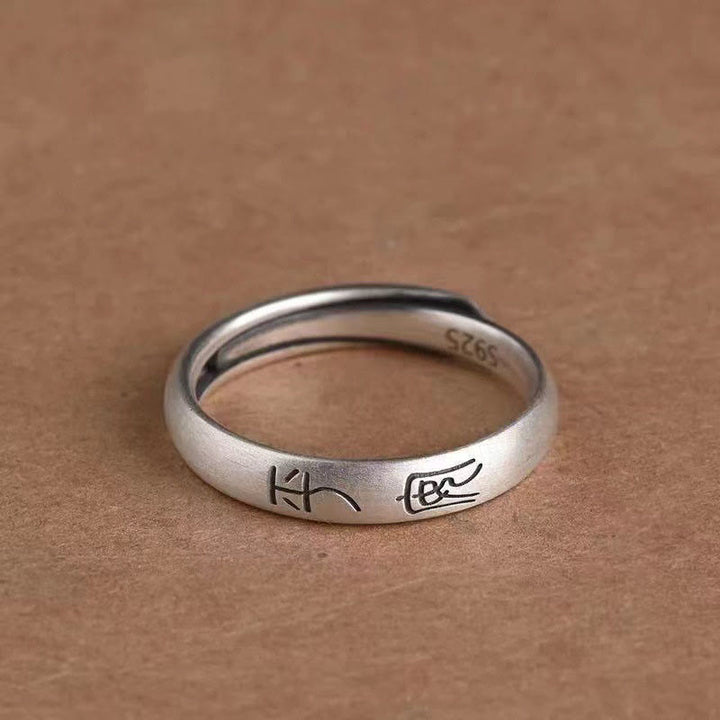 Anillo de riqueza de la suerte de cobre de paz y alegría