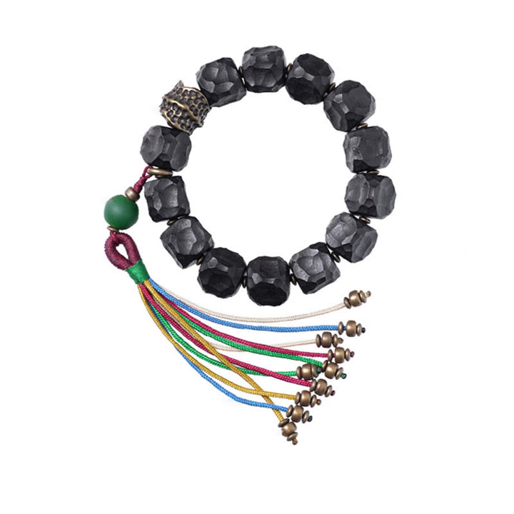 Pulsera Mala de muñeca con borla de paz de cobre y madera de ébano del Tíbet