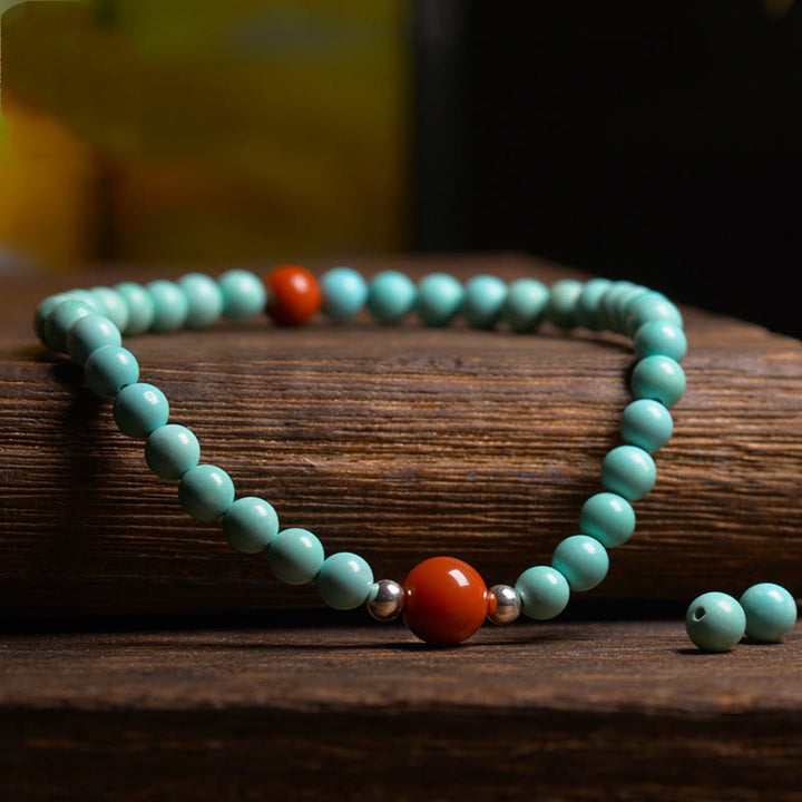 Pulsera de protección de cuentas de ágata roja turquesa de Buddha Stones - image 3