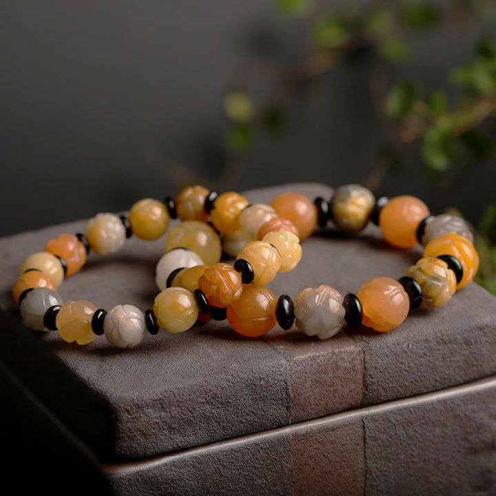 Pulsera de suerte y riqueza de loto de jade de seda dorada