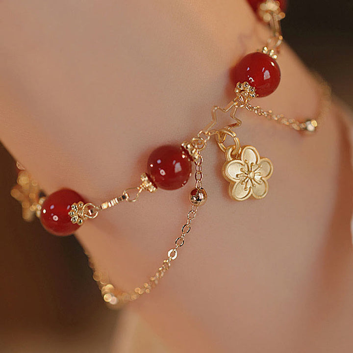 Pulsera tranquila con dije de flor de estrella de ágata roja chapada en oro de 14 Buddha Stones