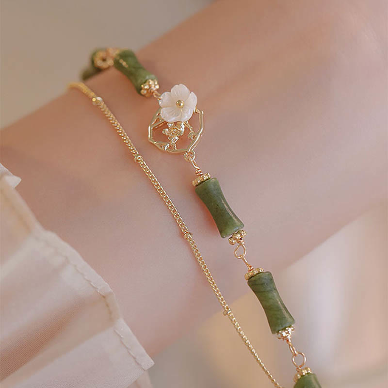 Pulsera de doble capa de cobre chapado en oro de 14 quilates con Buddha Stones , peridoto, flor de bambú y riqueza