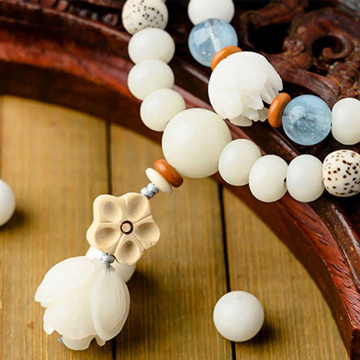 Pulsera de bendición de loto Bodhi de jade blanco tibetano con Buddha Stones
