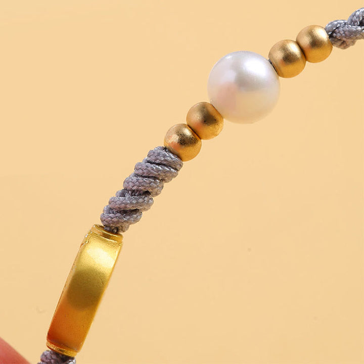 Pulsera trenzada de cuerda azul con Buddha Stones, moneda de cobre, árbol de la fortuna, perla, suerte