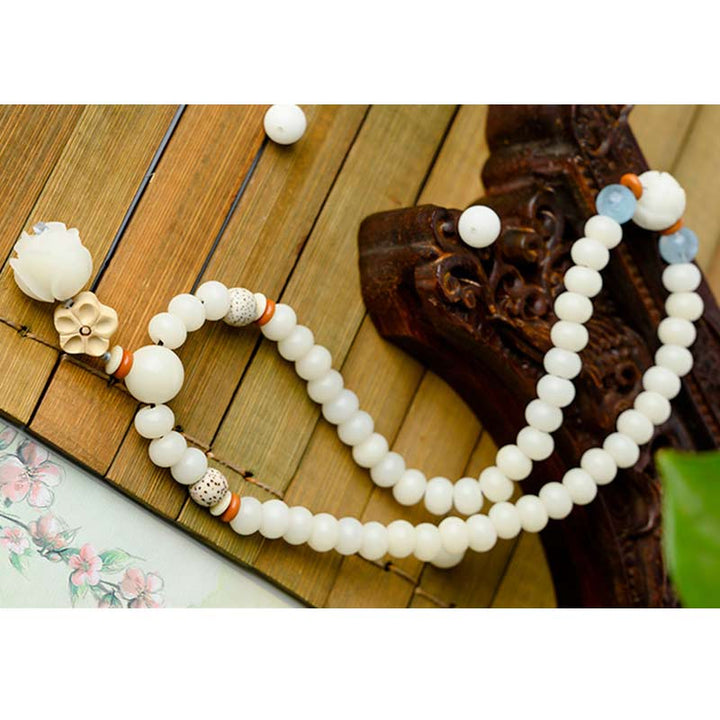 Pulsera de bendición de loto Bodhi de jade blanco tibetano con Buddha Stones