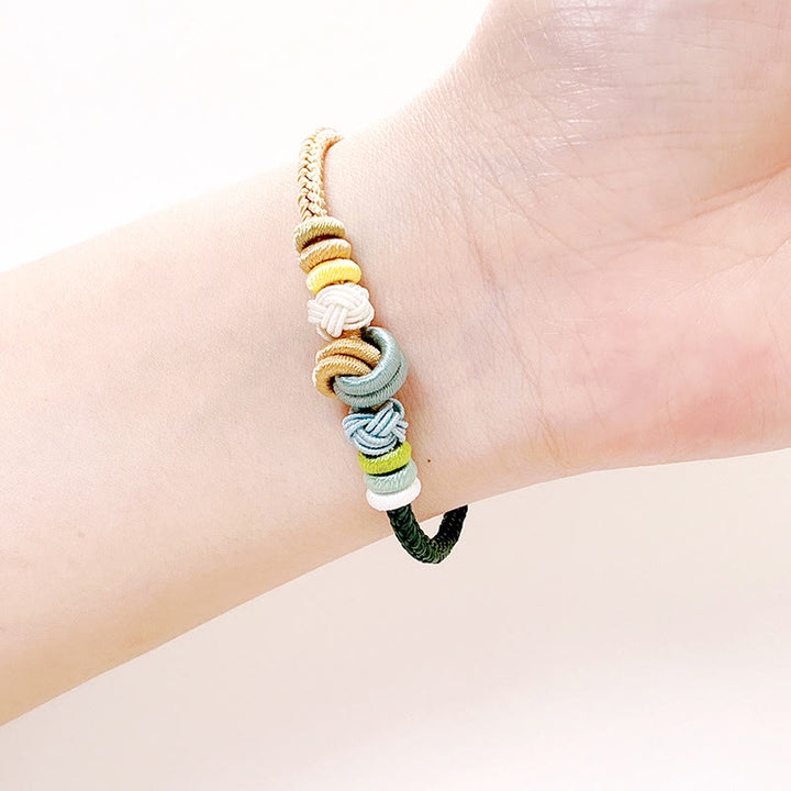 Pulsera de conexión de suerte con nudo de paz de ocho hilos hecha a mano con cuerda de dos colores con Buddha Stones