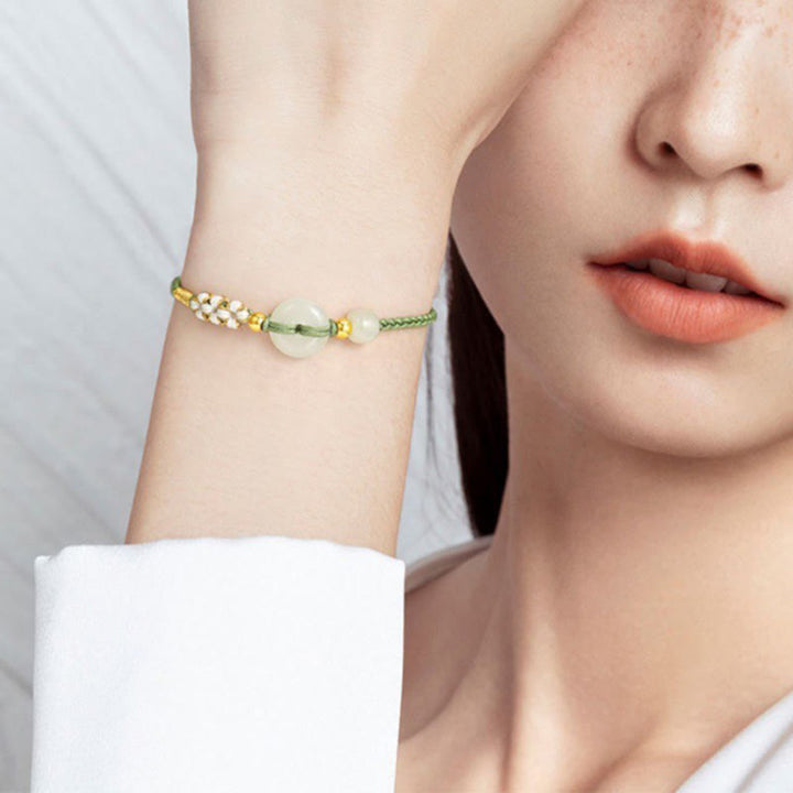 Pulsera trenzada de flor de melocotón de la suerte con hebilla de la paz de jade hetiano de Buddha Stones