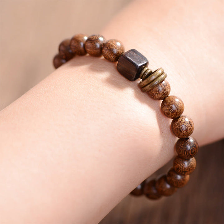 Pulsera de espiritualidad de madera de Phoebe Zhennan con Buddha Stones