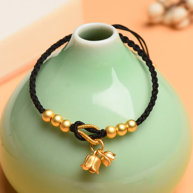 Pulsera trenzada de protección de la suerte con diseño de amuleto de flor de lirio de los valles hecha a mano con Buddha Stones