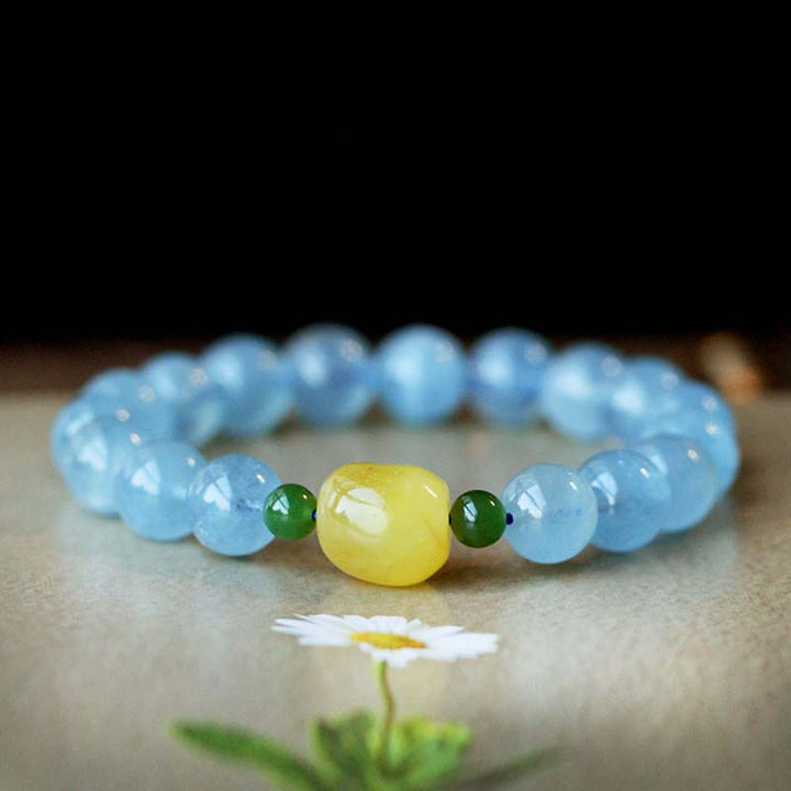 Pulsera curativa de serenidad con cuentas de ámbar y aguamarina natural