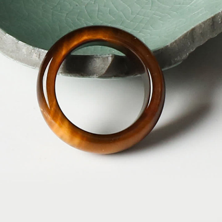 Anillo de protección de fuerza de piedra de ojo de tigre de Buddha Stones - image 1