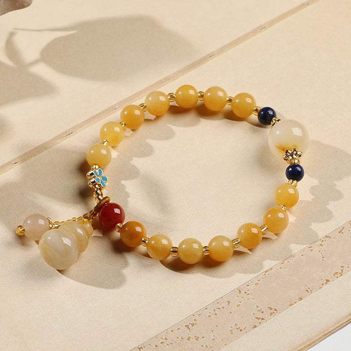 Pulsera de la suerte de la riqueza del encanto de la calabaza del jade de la seda dorada natural de las Buddha Stones