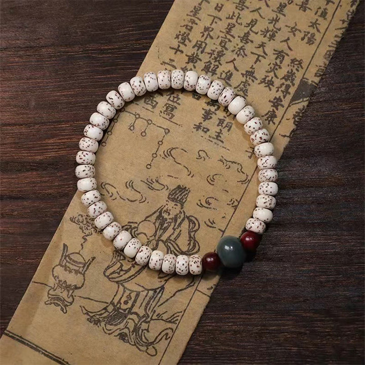 Pulsera de sabiduría de sándalo rojo con hojas pequeñas y semillas de Bodhi de Buddha Stones