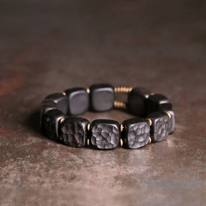Pulsera de equilibrio de paz de cobre estilo textura de madera de ébano retro con Buddha Stones