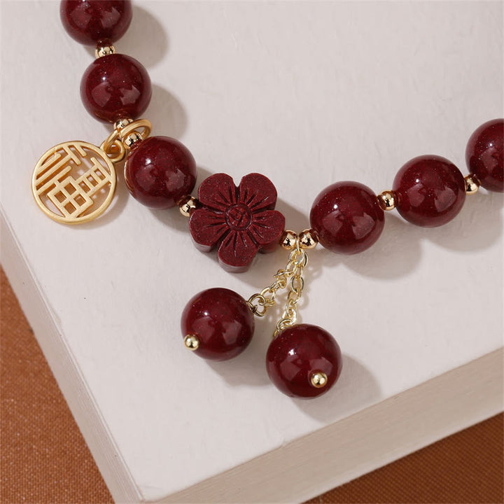 Pulsera de bendición de flor de cerezo con personaje de cinabrio Fu de Buddha Stones