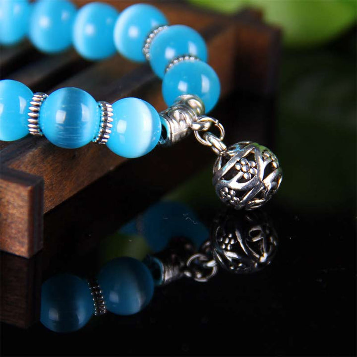 Pulsera de la suerte con ojo de gato tibetano y Buddha Stones