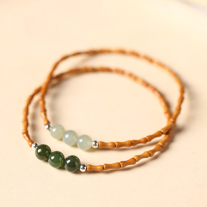 Pulsera de la suerte con cuentas de jade hetiano con patrón de bambú de oliva natural con Buddha Stones