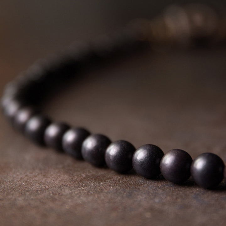 Pulsera de pareja de protección de cobre con cuentas Dzi de madera de ébano y Buddha Stones