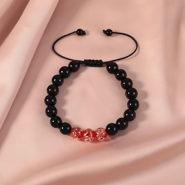 Pulsera de fuerza con piedra luminosa luminosa de obsidiana negra de Buddha Stones