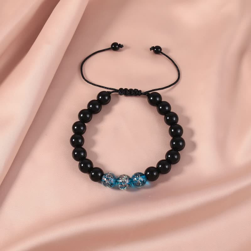 Pulsera de fuerza con piedra luminosa luminosa de obsidiana negra de Buddha Stones