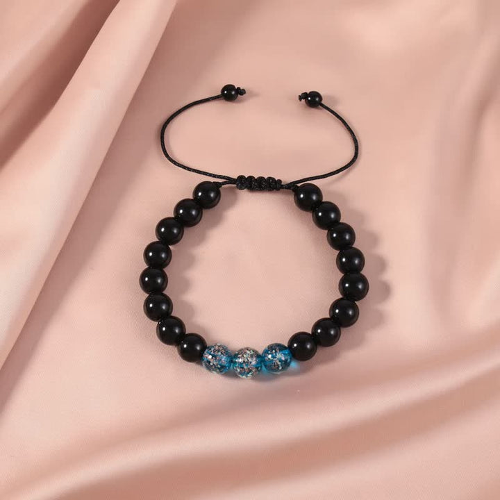 Pulsera de fuerza con piedra luminosa luminosa de obsidiana negra de Buddha Stones