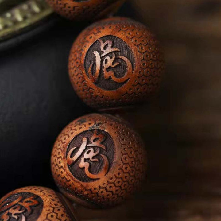 Pulsera de protección de tigre con grabado de palisandro tibetano con Buddha Stones