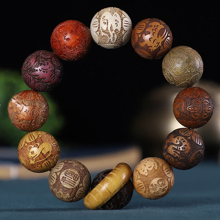 Buddha Stones Zodíaco chino Palisandro Sándalo verde Madera de ébano Moneda de cobre tallada Pulsera tranquila