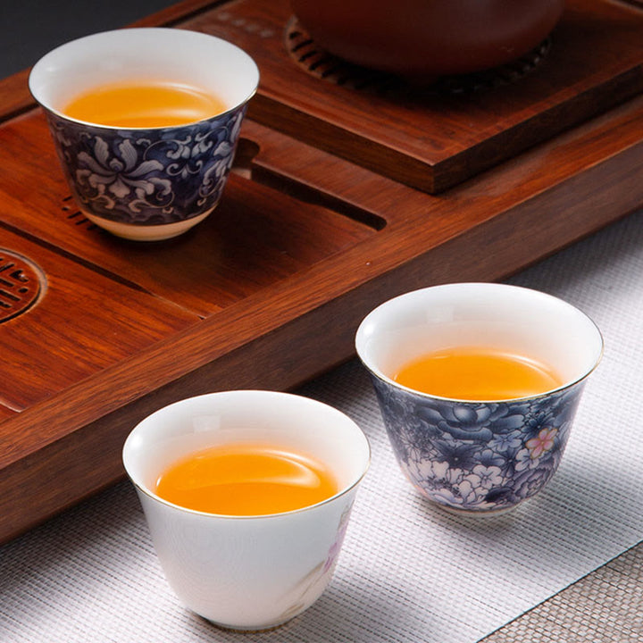 Taza de té de cerámica de porcelana azul y blanca, Buddha Stones, flores coloridas, orquídeas, olas del mar, taza de té de Kung Fu