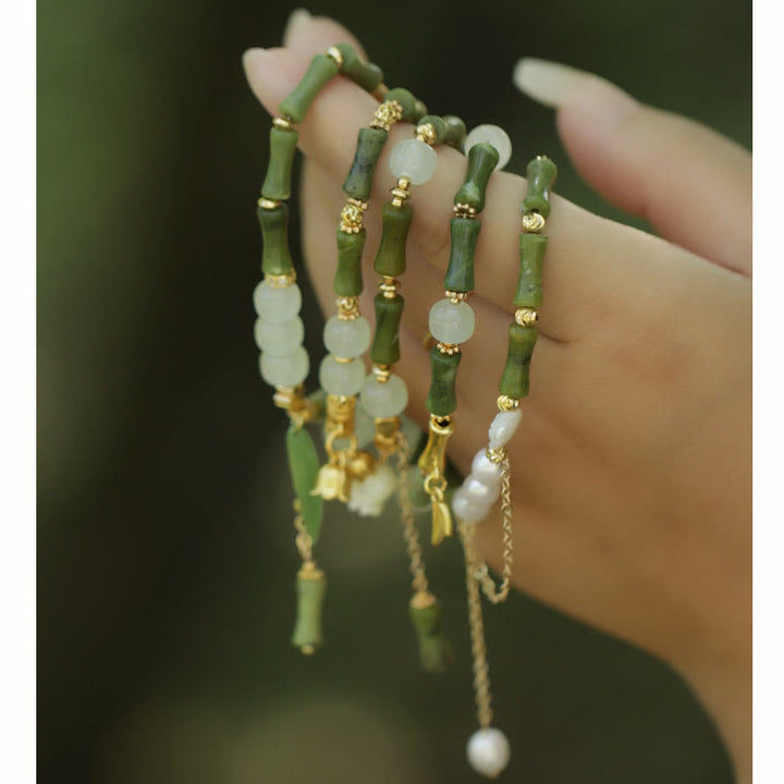 Pulsera de riqueza con Buddha Stones, bambú verde, jade, lirio de los valles