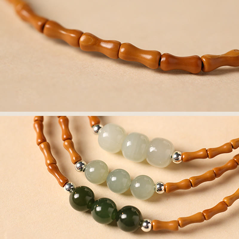 Pulsera de la suerte con cuentas de jade hetiano con patrón de bambú de oliva natural con Buddha Stones