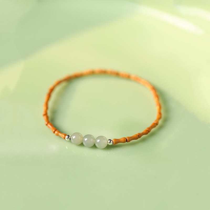 Pulsera de la suerte con cuentas de jade hetiano con patrón de bambú de oliva natural con Buddha Stones
